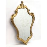 An 18th century style Rococo ornate gilt framed mirror. 58x94cm