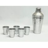 A Kaymet cocktail shaker and 5 matching shot cups.