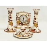 4 pieces of Mason’s Brown Velvet pottery. A pair of candlesticks 16.5cm, a mantle clock 14x13cm, a