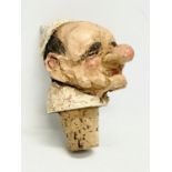 A large stoneware stopper in the form of Pope Paul VI. 15cm