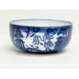 A late 19th century Doulton Burslem ‘Willow’ pattern bowl. 20x9cm.