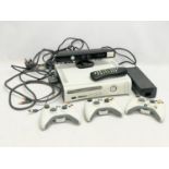 An XBOX 360 console with 3 controllers, a Kinect, an XBOX remote and leads.