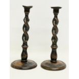 A pair of tall early 20th century Barley Twist oak candlesticks. 1900-1910. 13.5x32cm.