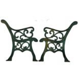 A pair of large cast iron garden bench ends. 71x77cm