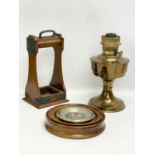 A sundry lot. Including an Edwardian oak tantalus. An Aladdin brass oil lamp and a barometer.