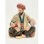A Royal Doulton ‘Omar Khayyam’ pottery figurine. 13x16cm