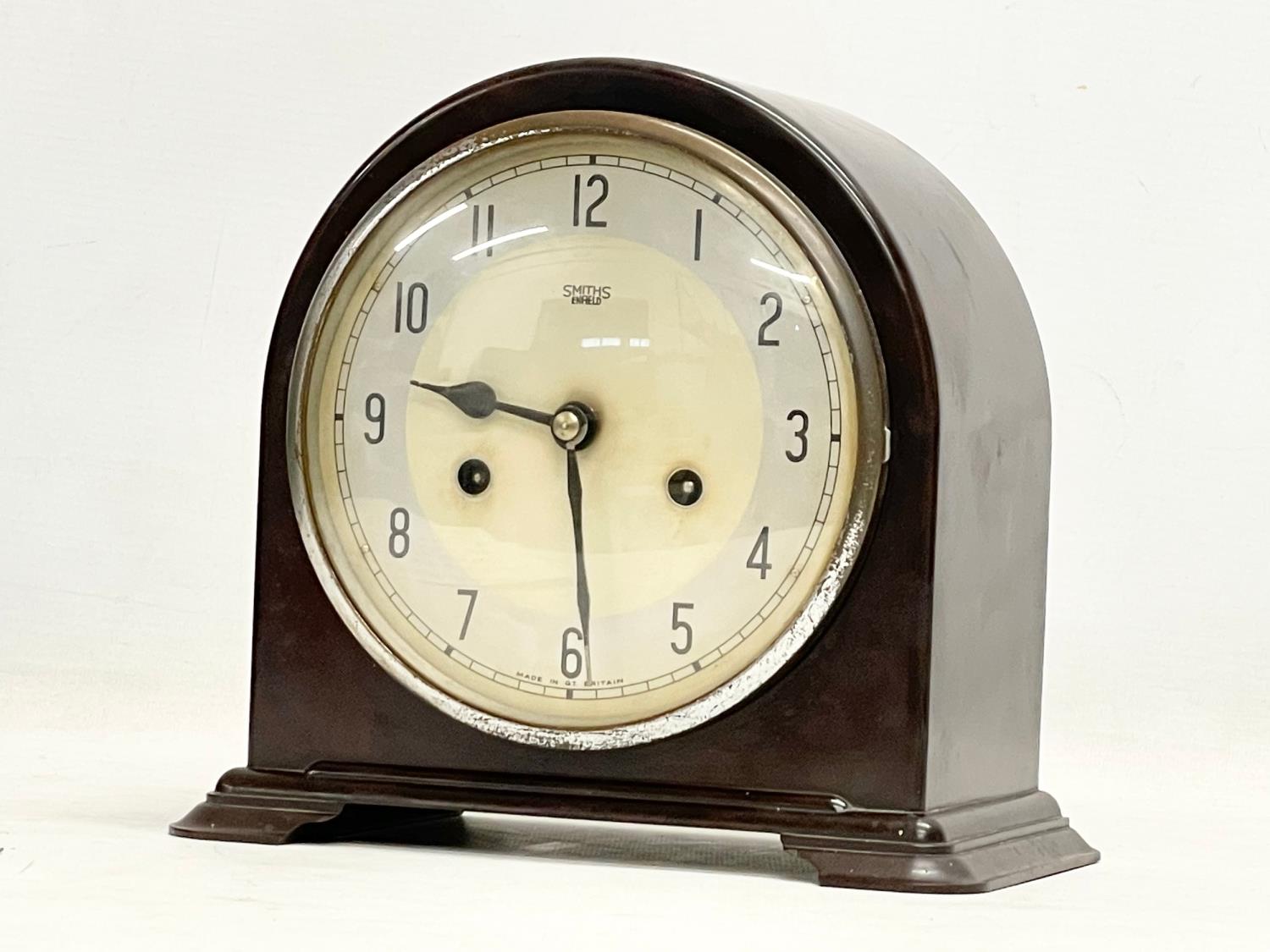 A vintage Art Deco Bakelite mantle clock by Smiths Enfield. With key and pendulum. 22x12x20cm
