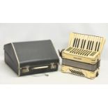 A Hohner Student IV accordion in case.