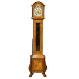A mahogany and burr walnut long case clock with brass moon dial face. By Warmink. Weights and