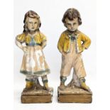 A pair of early 20th century plaster figures. 34cm
