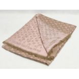 A ladies Louis Vuitton scarf.