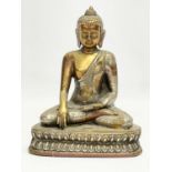 An early 20th century copper and brass Deity figure. 16x20cm.