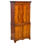 A Georgian style flamed mahogany cocktail cabinet. 73x42x155cm