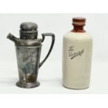 A vintage silver plated cocktail shaker and a stoneware bottle. 25cm