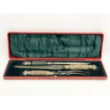 A late 19th century silver plated and horn carving set. James Deakin & Sons. 46cm