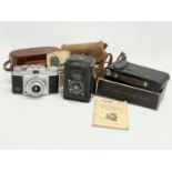 3 vintage cameras.