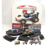 A Mario Kart Slot Racing System by Carrera. Box measures 60x50cm