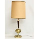 A tall 1960’s Mid Century brass and rosewood table lamp. 73cm