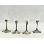 A set of 4 crystal wine glasses with silver plated stems. 16cm.