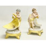 A pair of late 19th/early 20th century German porcelain cherub stands. 13x16.5cm