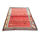 A large vintage North African hand knotted rug. 291x209cm