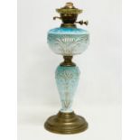 A Victorian ornate gilt glass double burner oil lamp. 50cm