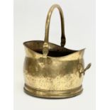 An early 20th century brass coal scuttle. 33x30x40cm including handle.