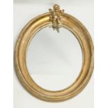 An ornate gilt framed mirror. 41x53cm