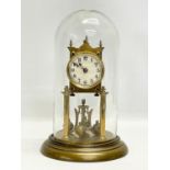 An early 20th century brass Anniversary clock with glass dome. 32cm