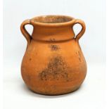 A terracotta 2 handled pot.