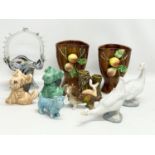 A sundry lot of pottery. Including 4 Sylvac animals, a pair of Italian vases 15cm, 2 Nao swans etc