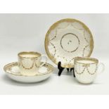 A pair of early 19th century Crown Derby porcelain cups and saucers.