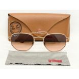 A pair of ladies Ray Ban sunglasses in case.