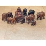 A quantity of carved wooden elephants etc.