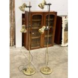 A pair of vintage brass uplighters. 154cm
