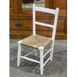 A child’s late Victorian chair with rush seat