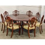 A Hepplewhite style yew wood table and 8 chairs.