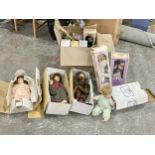 A collection of vintage dolls in boxes.