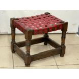 A 1930’s footstool with leather top