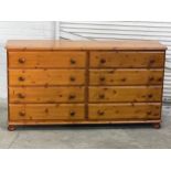 A large pine chest of drawers. 165x45x88.5cm