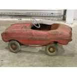 A vintage child’s peddle car for restoration