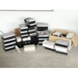 A large quantity of ladies shoes and high heels in boxes.