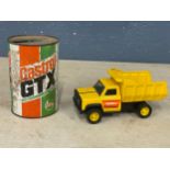 A vintage Tonka truck and a Castrol GTX oil can.