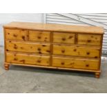 A large pine chest of drawers. 150x45x70cm
