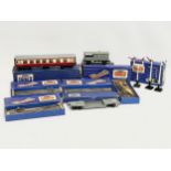A collection of vintage Hornby Dublo train carriages and tracks etc in boxes.