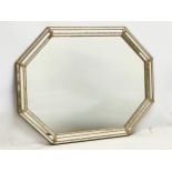 A large ornate brass framed mirror. 100x75cm