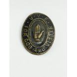 An original UVF badge.
