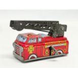 A vintage tinplate windup Yone fire engine. Made in Japan. 10cm closed.