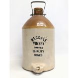 A vintage stoneware dispenser jug for wine. 45cm