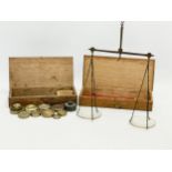 Late 19th century balance scales in case with weights in case.